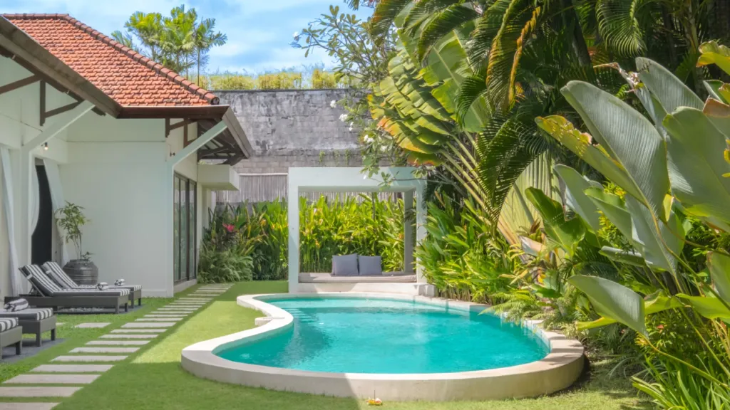 Free-form pool with a shaded pergola daybed at Villa Alice Satu