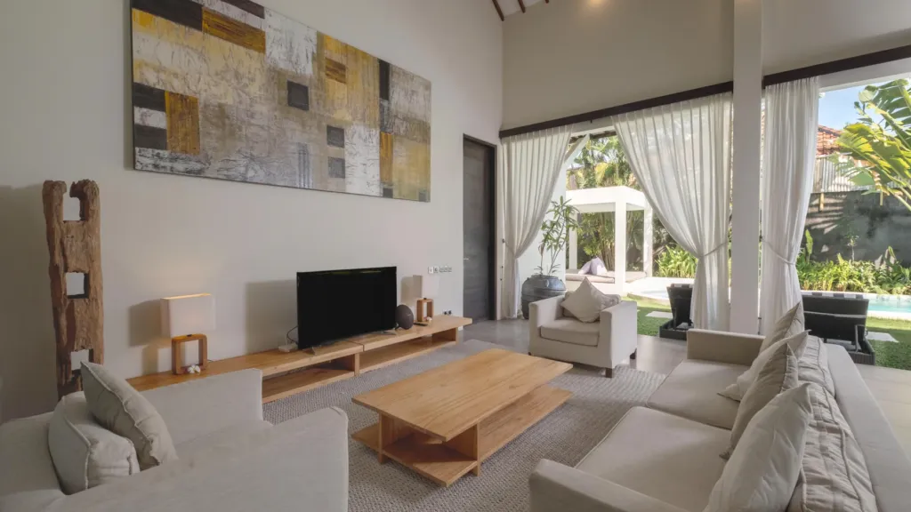 Living area opening to the pool at Villa Alice Satu