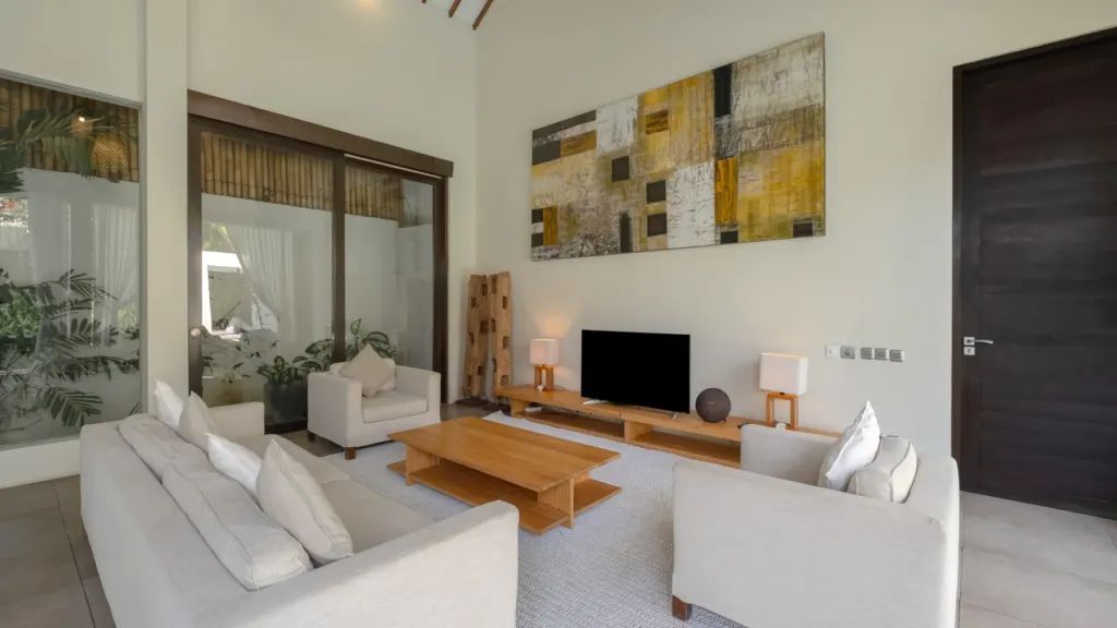 Living area with television at Villa Alice Satu