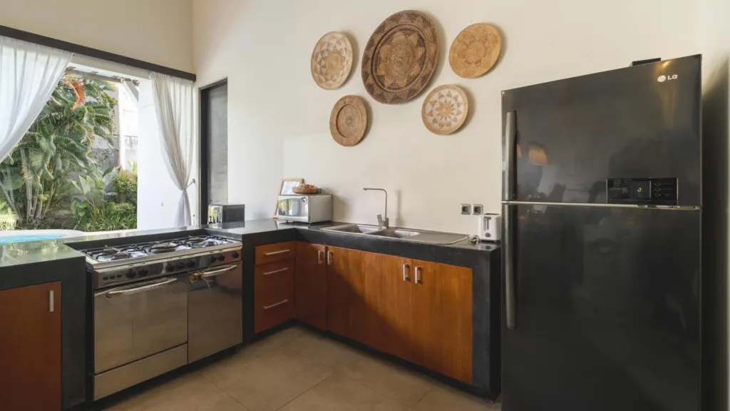 Fully equipped kitchen with range and fridge at Villa Alice Satu