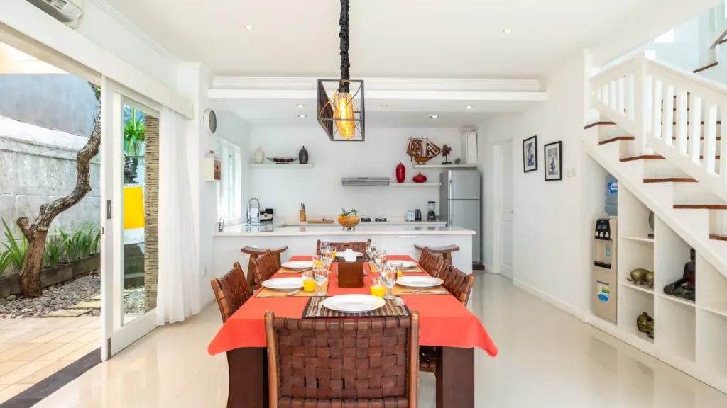 Villa Alun, Batu Belig — dining, table for six with the open kitchen behind