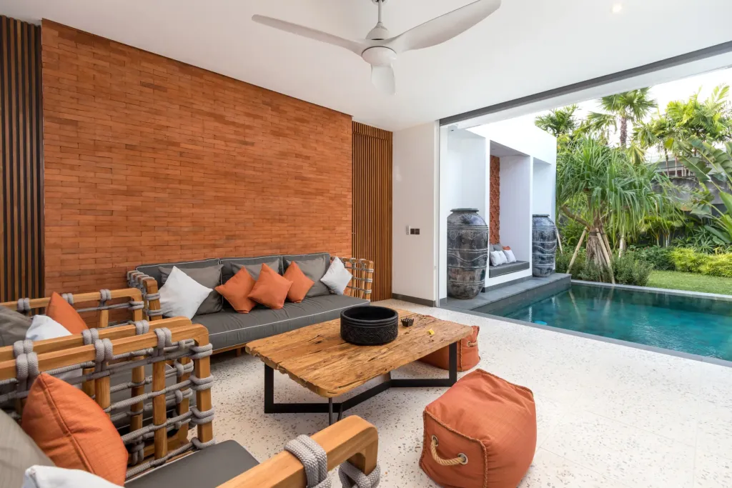Villa Castil di Udara, Kerobokan — living room, covered outdoor lounge beside the pool at Villa Castil di Udara