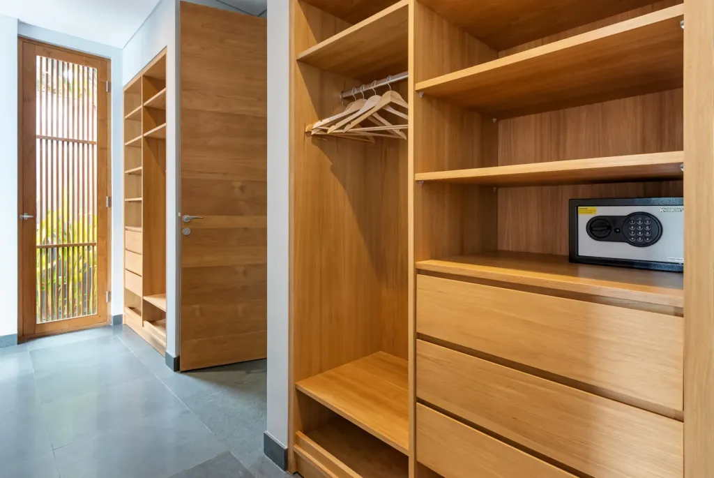 Villa Castil di Udara, Kerobokan — bedroom, walk-in wardrobe with shelving and a safe at Villa Castil di Udara