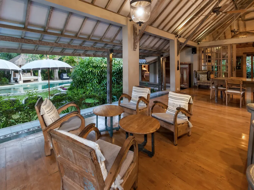 Rattan armchairs and carved timber detail in Villa Koyama's living pavilion