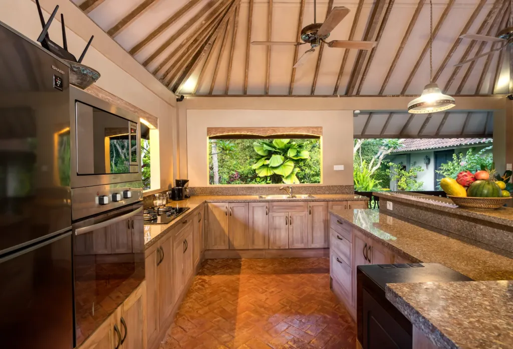 Fully equipped kitchen at Villa Koyama with oven and granite counters