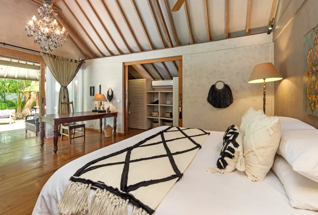 Master bedroom at Villa Koyama with crystal chandelier and dressing area
