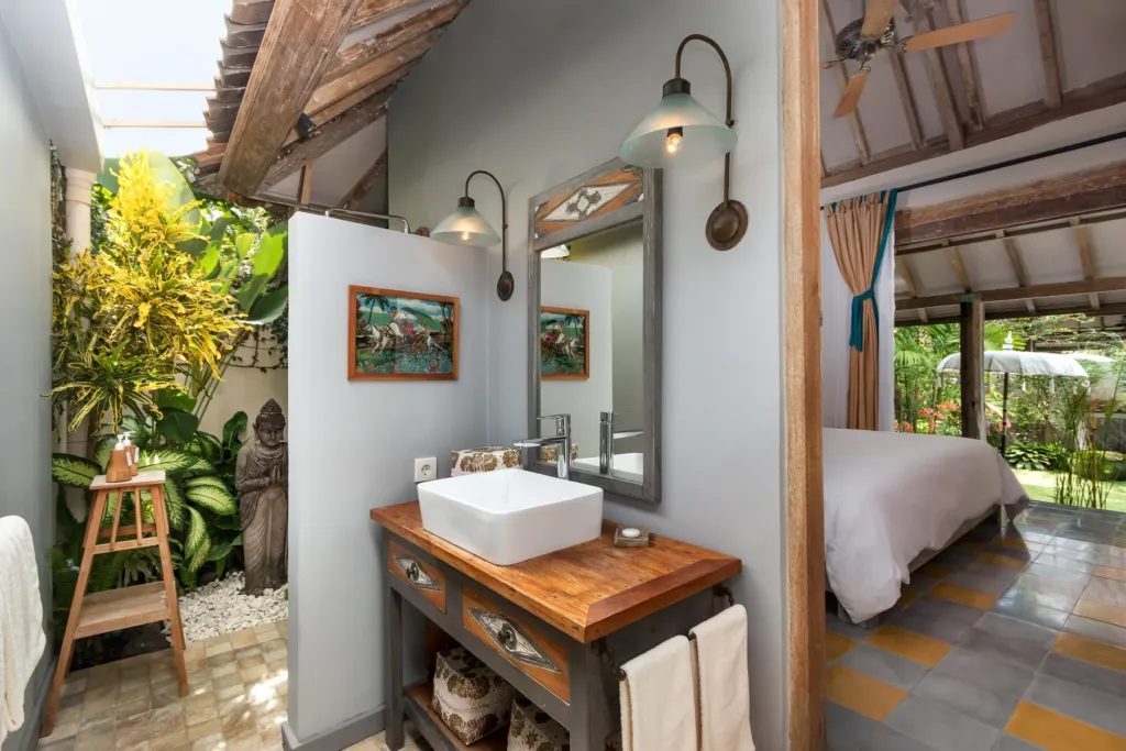 Semi-open en-suite at Villa Koyama with timber vanity and greenery