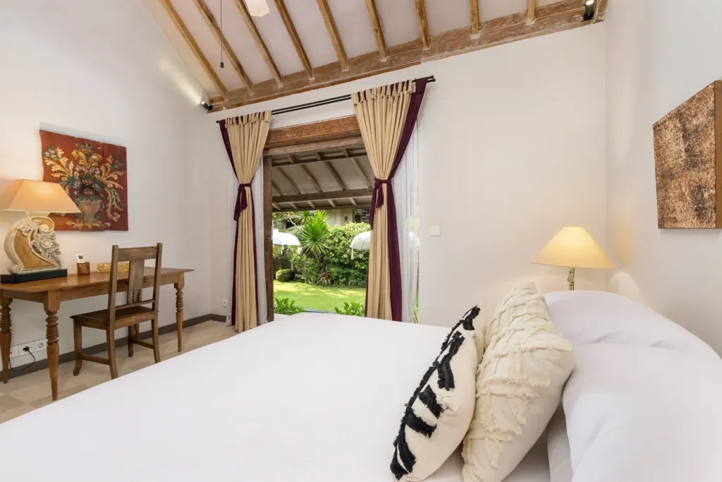King bedroom at Villa Koyama with desk and veranda onto the garden