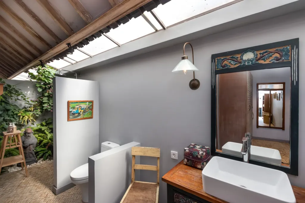 Semi-open en-suite bathroom at Villa Koyama with stone basin
