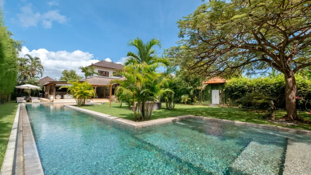 Villa Mogi, Seminyak — pool, lawn at Villa Mogi shaded by a large rain tree