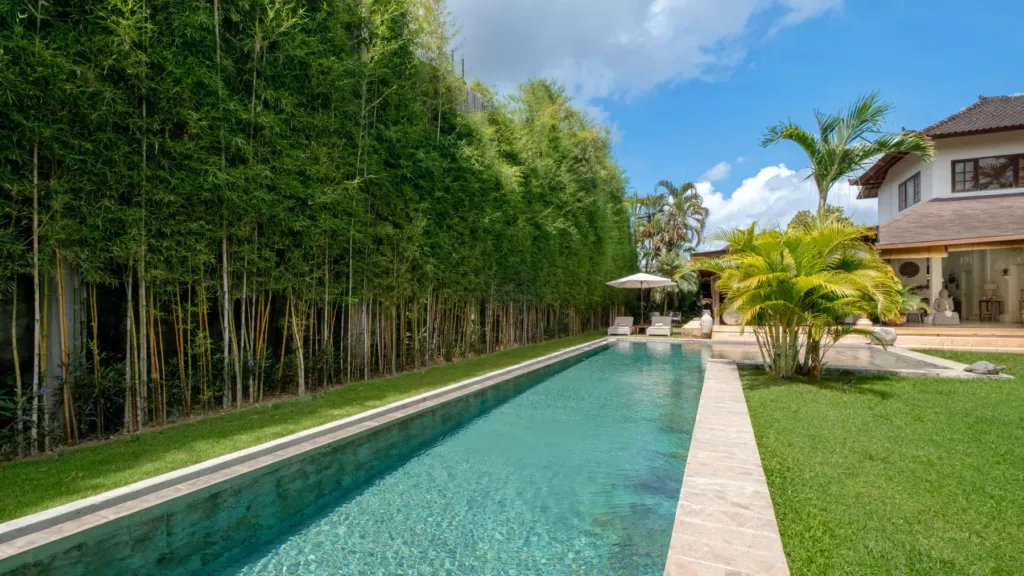Villa Mogi, Seminyak — pool, villa Mogi running the length of the tropical garden