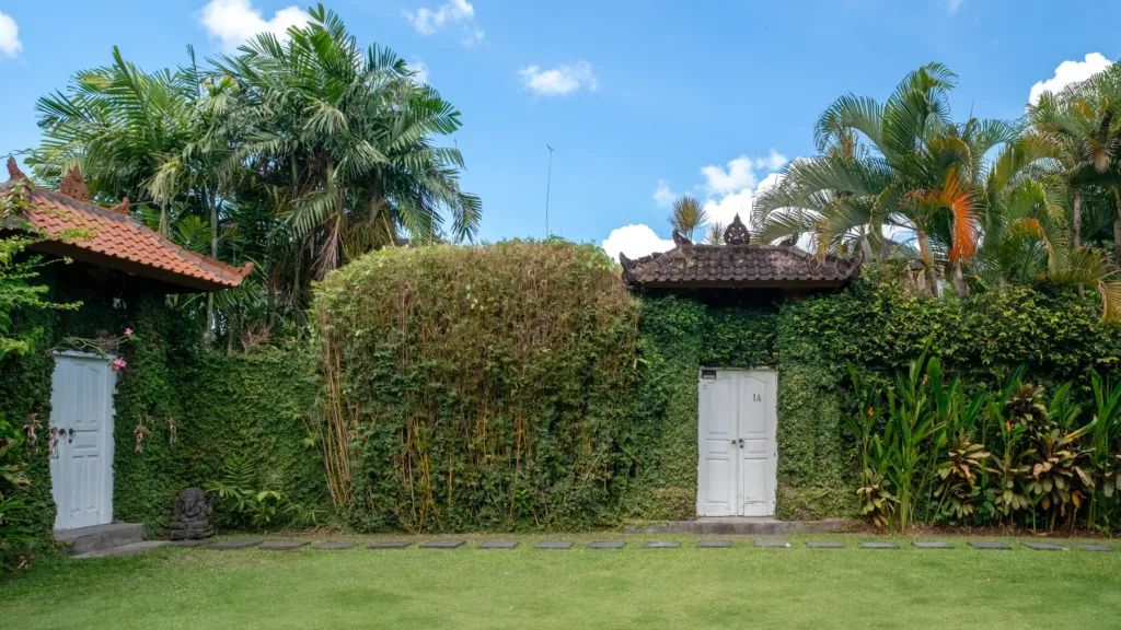 Villa Mogi, Seminyak — garden, open lawn at Villa Mogi, larger than the villa itself, walled by tall hedging