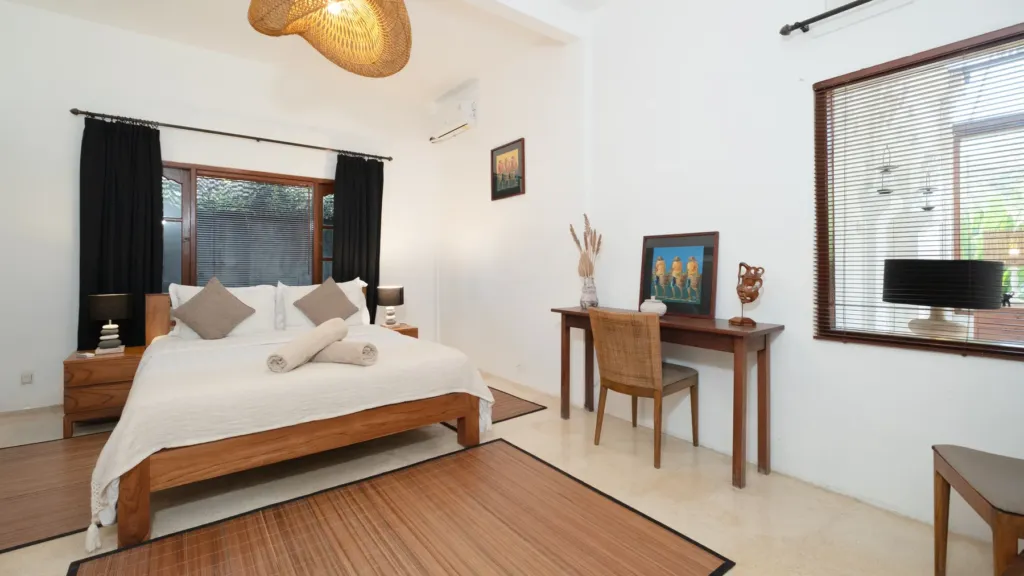 Villa Mogi, Seminyak — bedroom, villa Mogi with a writing desk and mirror beside the bed