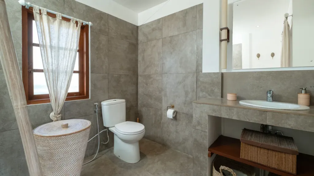 Villa Mogi, Seminyak — bathroom, stone basin and timber counter in a bathroom at Villa Mogi
