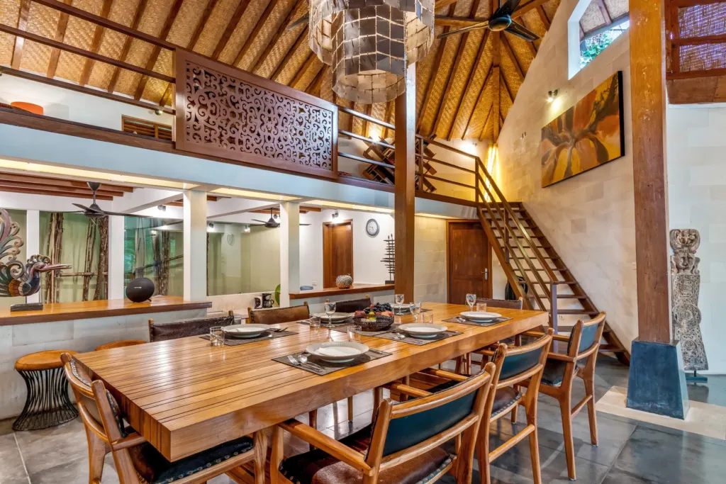 Dining area at Villa Shantika with the staircase up to the mezzanine