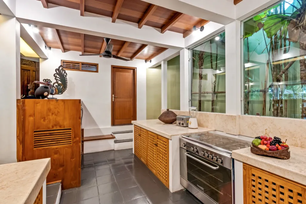Fully equipped kitchen at Villa Shantika with a full oven and range