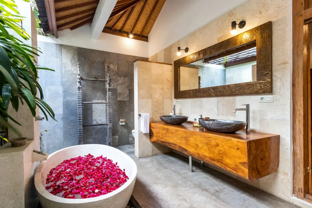 Master en-suite at Villa Shantika with stone basins on a timber counter