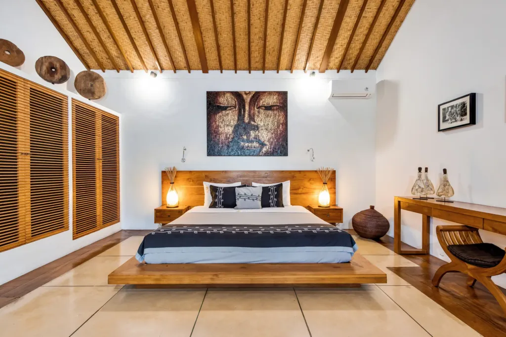 King bedroom at Villa Shantika with louvred shutters and tiled floor