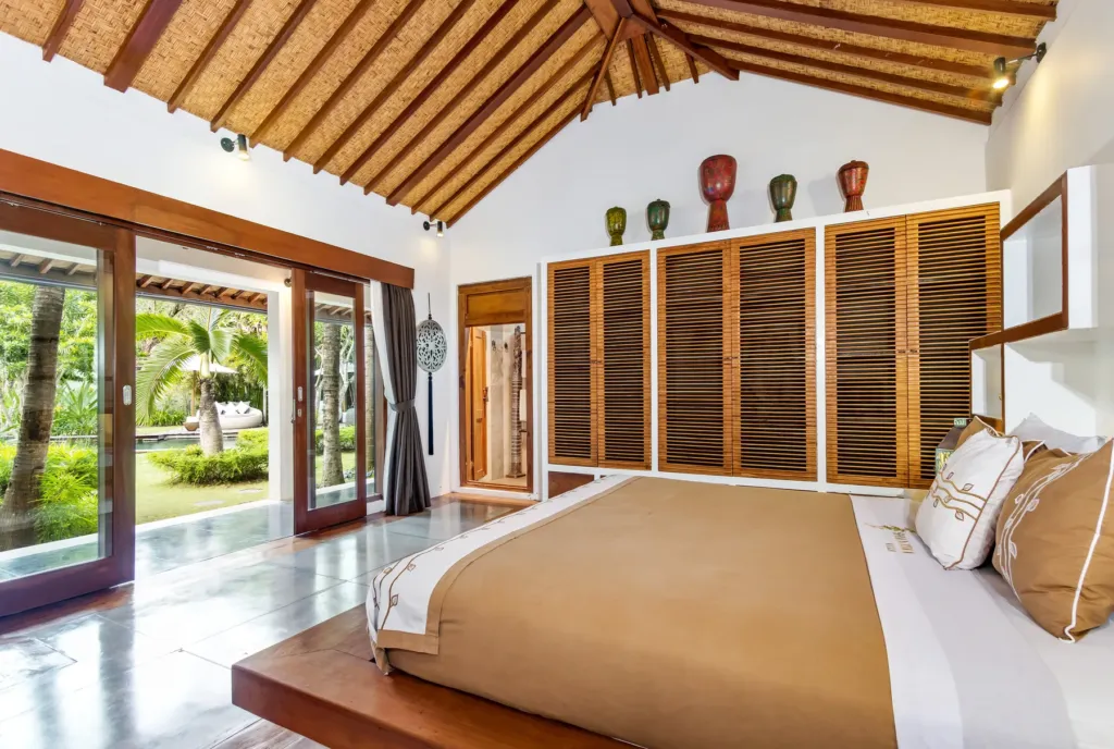 Bedroom at Villa Shantika with sliding doors onto the garden