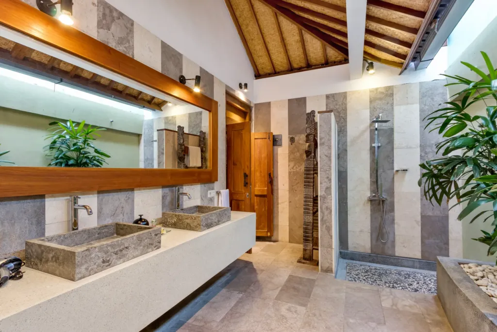 Tropical open-air en-suite bathroom at Villa Shantika