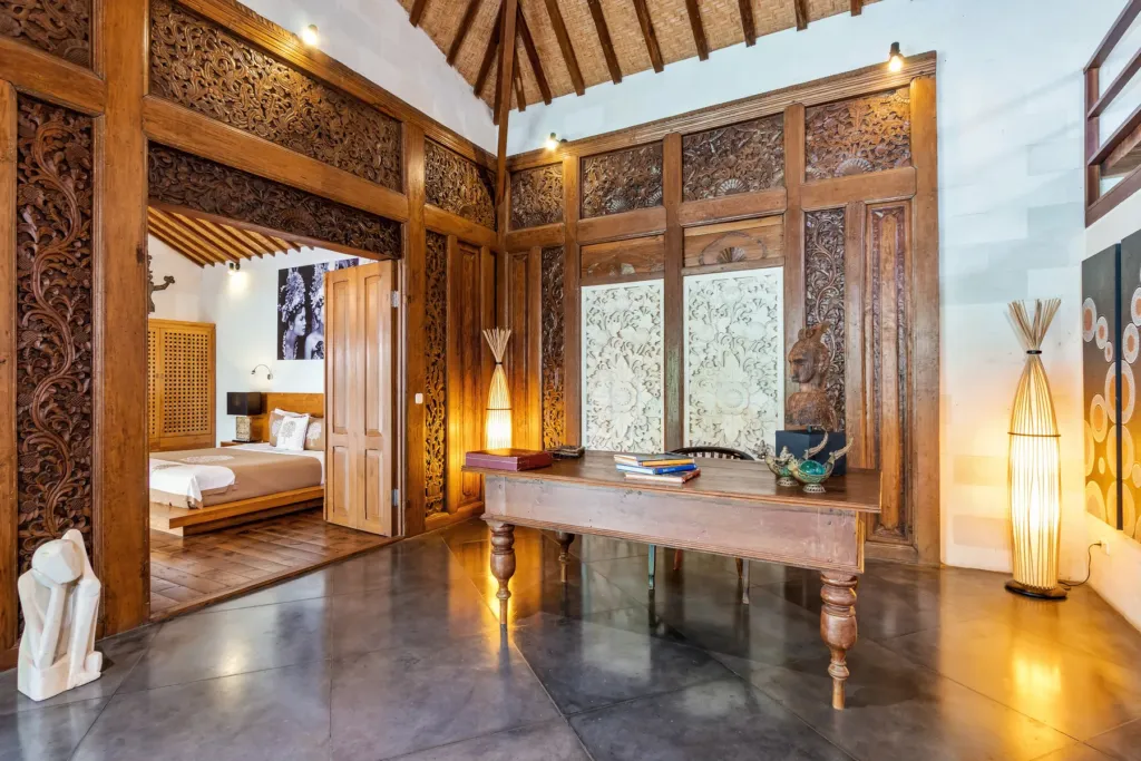 Carved timber doors leading into a bedroom pavilion at Villa Shantika