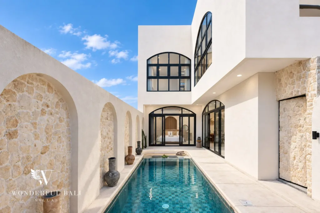 3BR villa for rent in Berawa, Canggu — pool, pool running between walls of arched pale stone