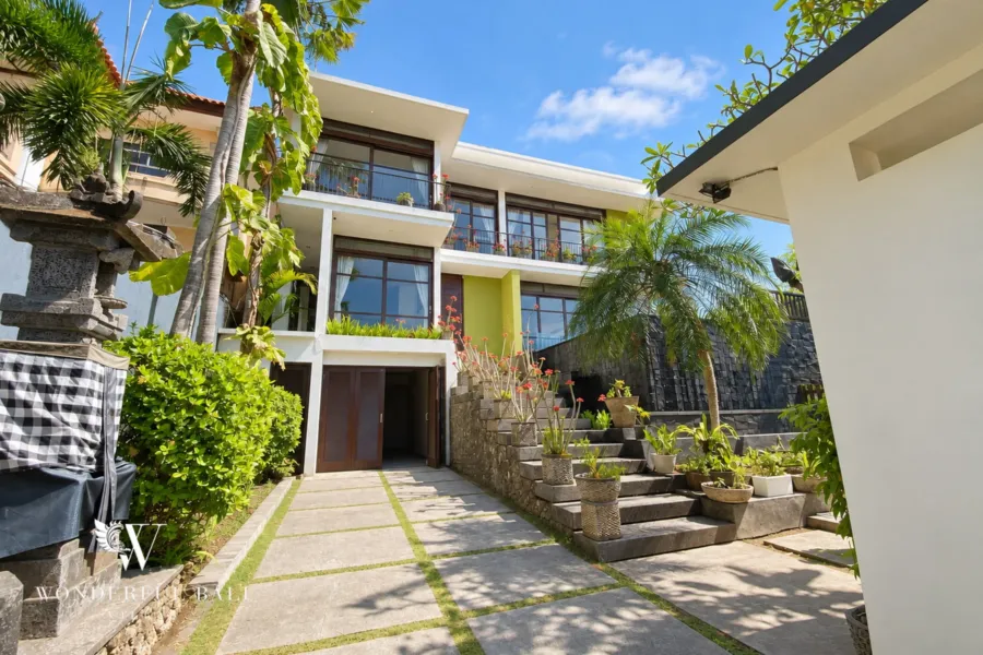 3BR villa for sale in Jimbaran — modern three-level villa above a terraced tropical garden in the Jimbaran hills