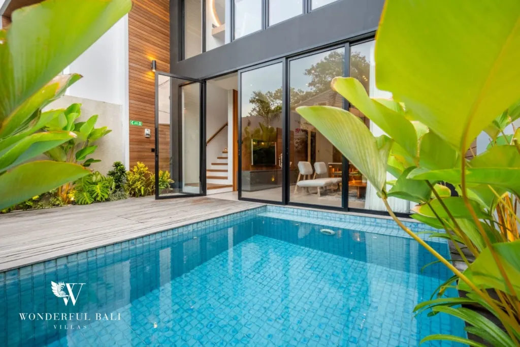 3BR villa for rent in Seminyak — pool, pool and timber deck in a planted courtyard