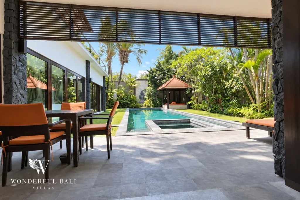 4BR villa for rent in Umalas, Bali — pool, shaded terrace and loungers beside the lap pool