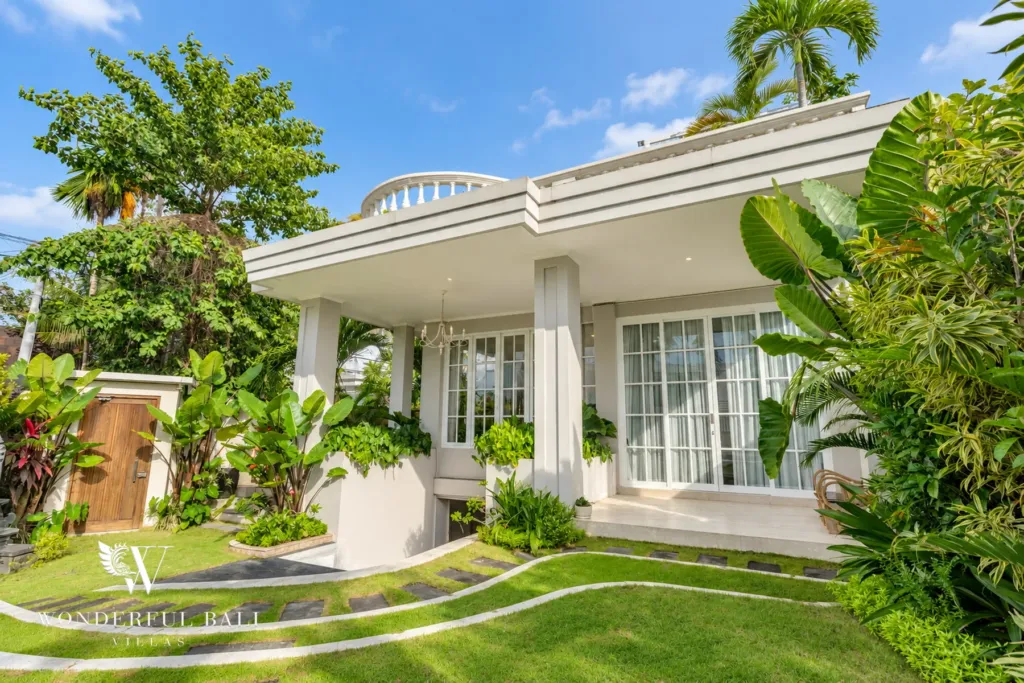 5BR villa for sale in Pererenan — white colonial-style facade with French windows and a tropical garden