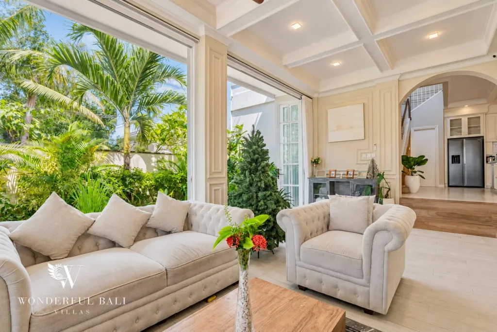 5BR villa for sale in Pererenan — living room with Chesterfield sofas opening to the garden