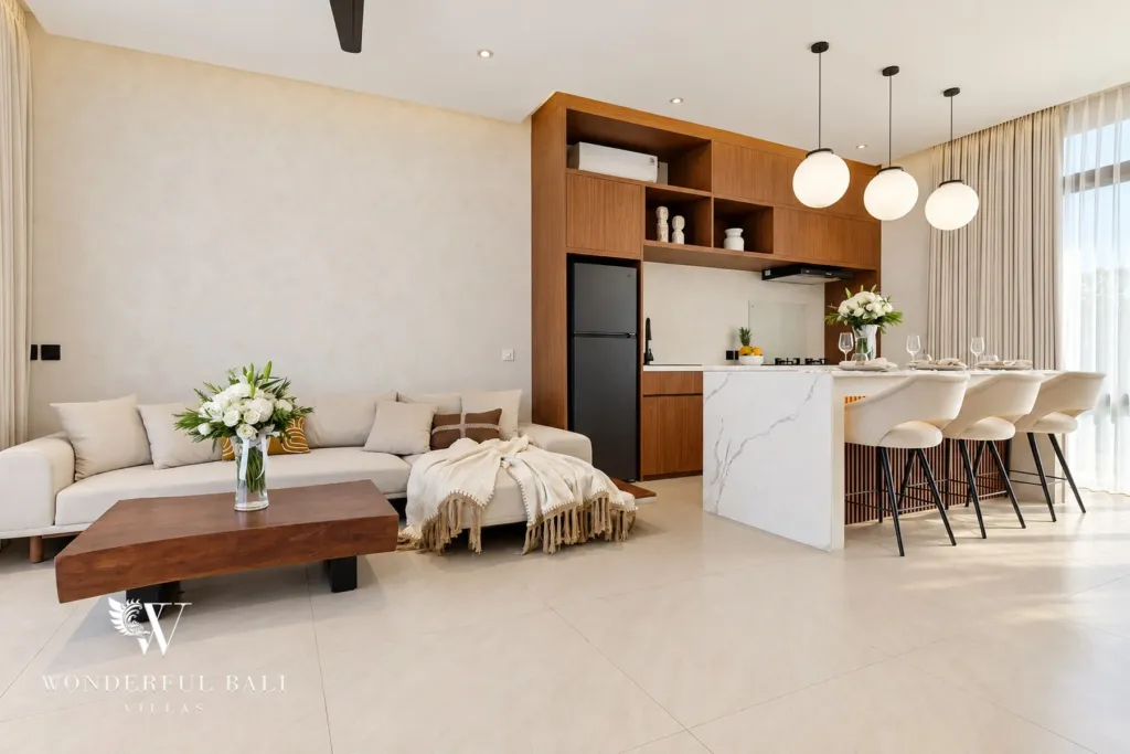 2BR villa for rent in Padonan, Canggu — living room, open-plan living with a sofa and marble kitchen island