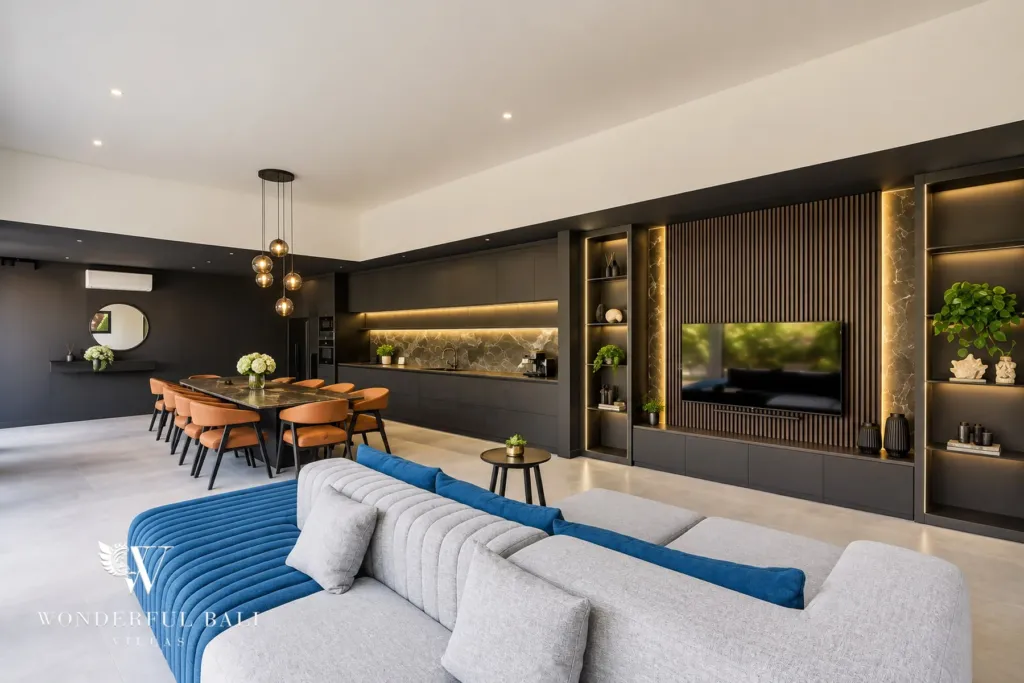 3br villa for sale umalas — open-plan living room with a backlit slat media wall and dining table for eight