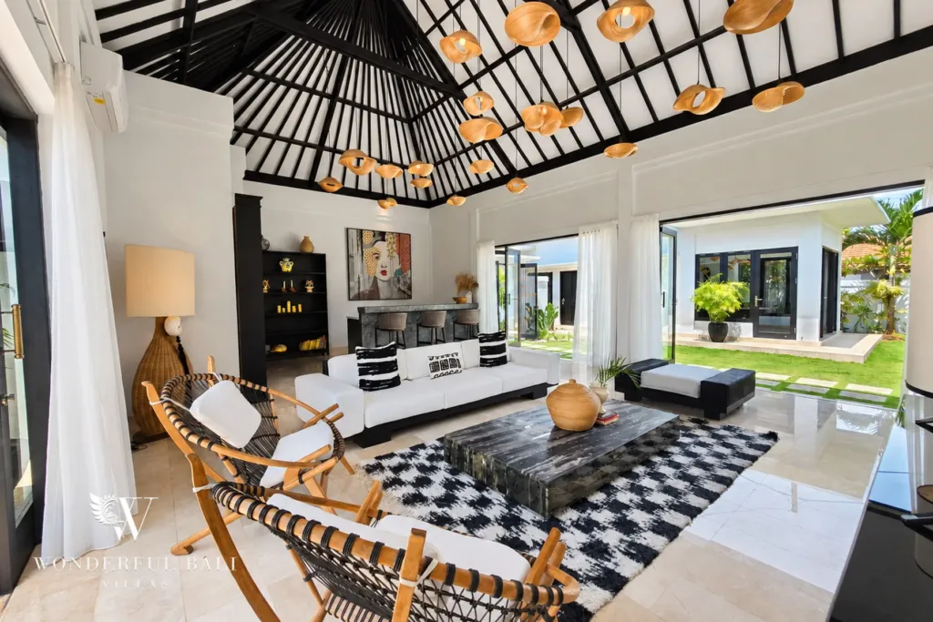 4BR villa for rent in Batu Bolong, Canggu — living room, open living room under a black timber roof with woven pendants