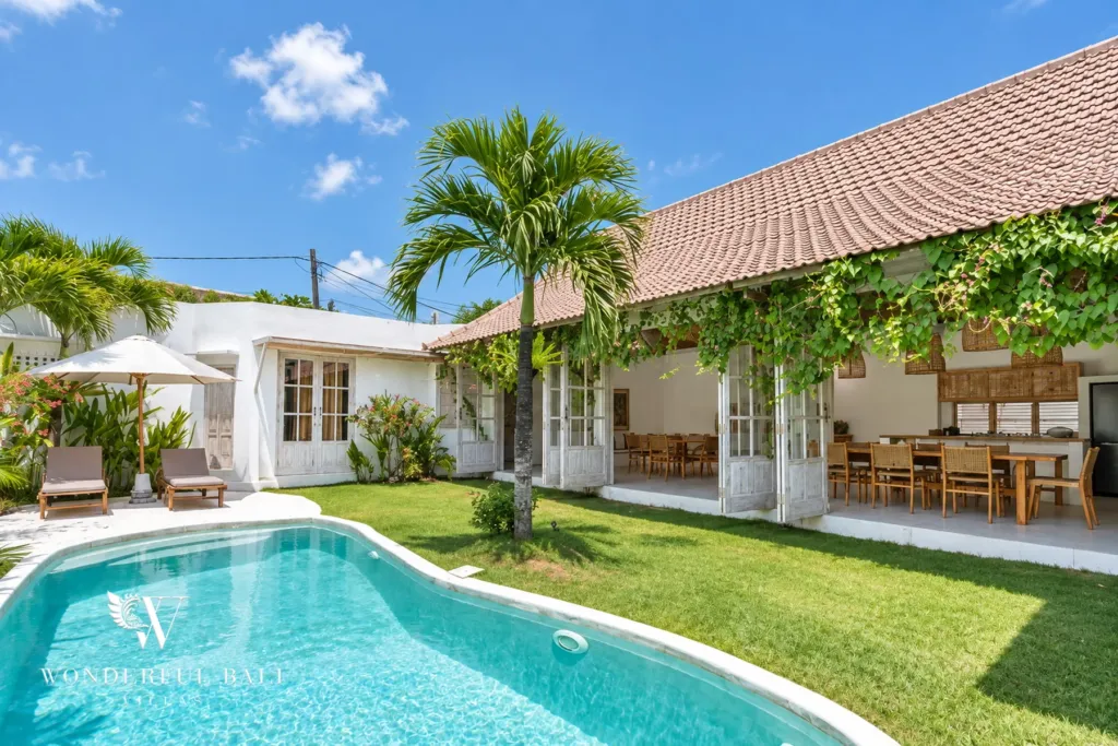 4BR villa for rent in Umalas, Bali — pool, curved pool with a shallow ledge, set in lawn and planting