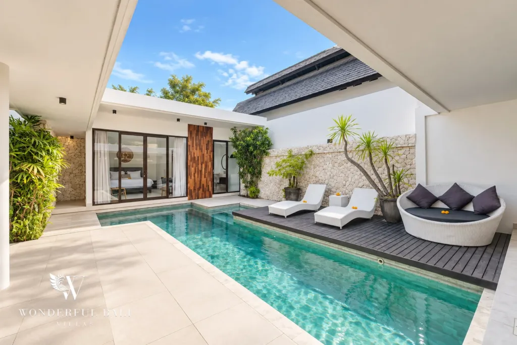 3BR villa in Berawa, Canggu, Bali — pool, sun loungers and a daybed on the deck beside the pool