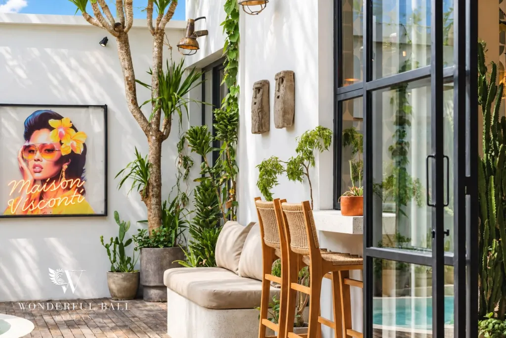 2BR villa for rent in Berawa, Canggu — courtyard lounge, built-in bench seat, rattan bar stools and a counter under the eaves