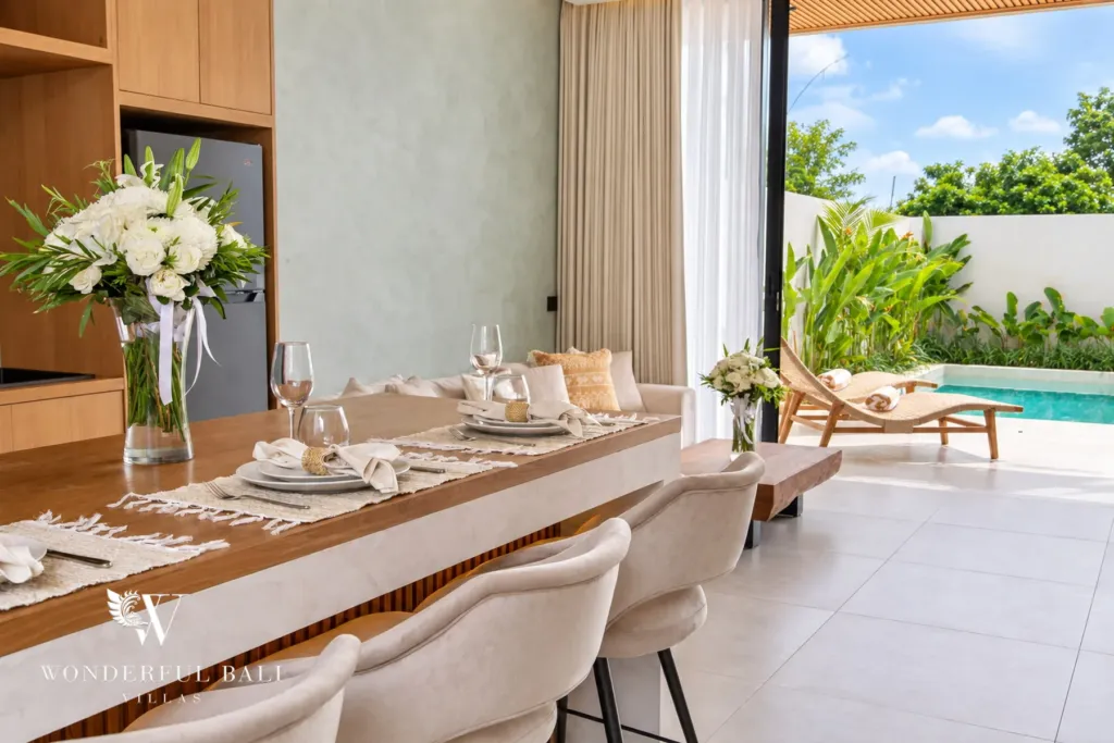 2BR villa for rent in Padonan, Canggu — dining, dining table opening onto the pool terrace