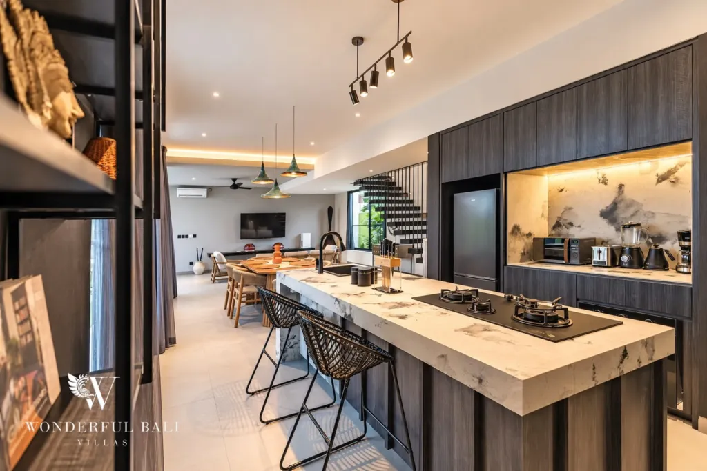 3BR villa for rent in Munggu — kitchen with stone-topped island, bar stools and gas hob