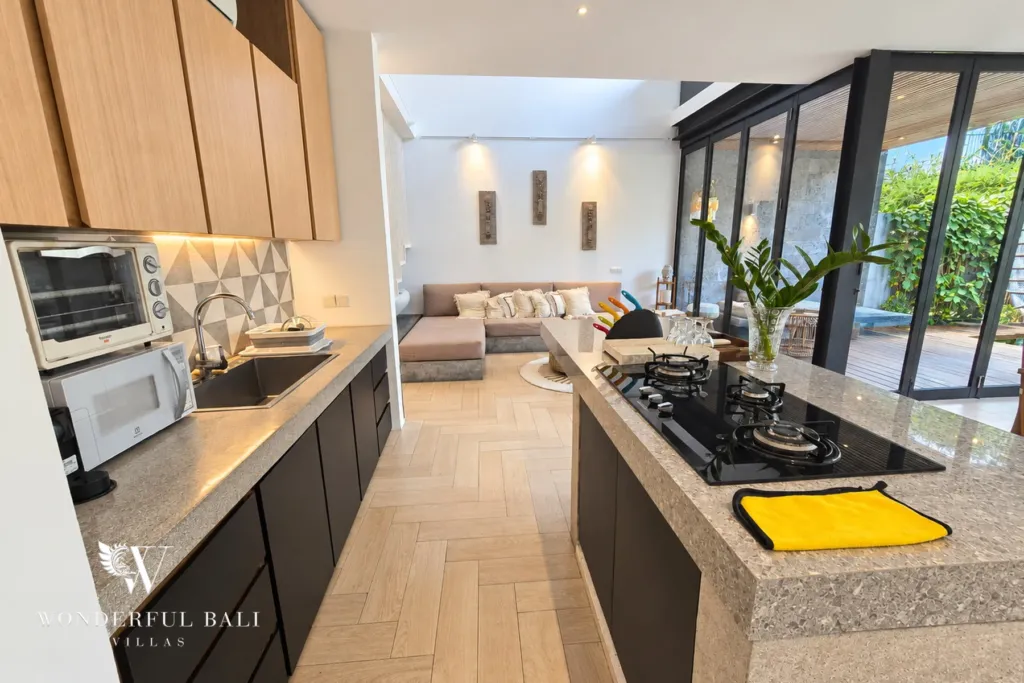 4BR villa for rent in Berawa, Canggu — kitchen, galley kitchen with a stone island and gas hob