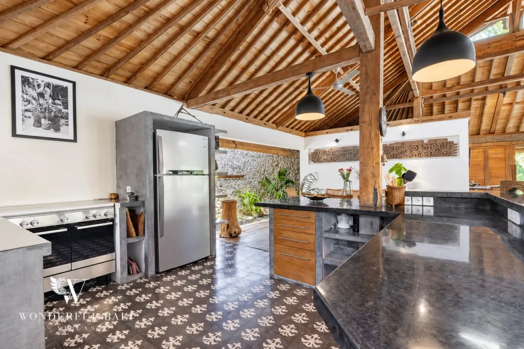 5BR villa for rent in Umalas — kitchen, black-stone counter, range cooker and patterned cement tiles