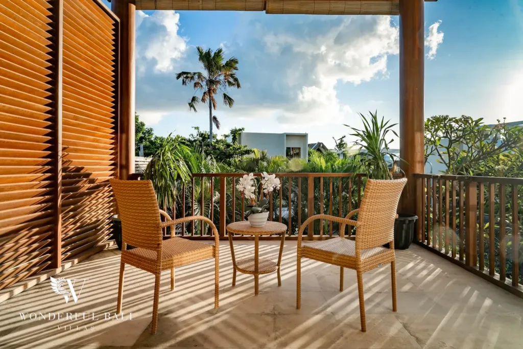 3BR villa for rent in Batu Belig, Seminyak — balcony, upstairs balcony with timber louvre screens and a table for two