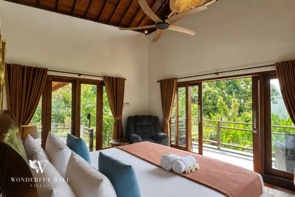 4BR villa for rent in Padonan, Canggu — bedroom 1, upstairs master with balcony doors onto the pool
