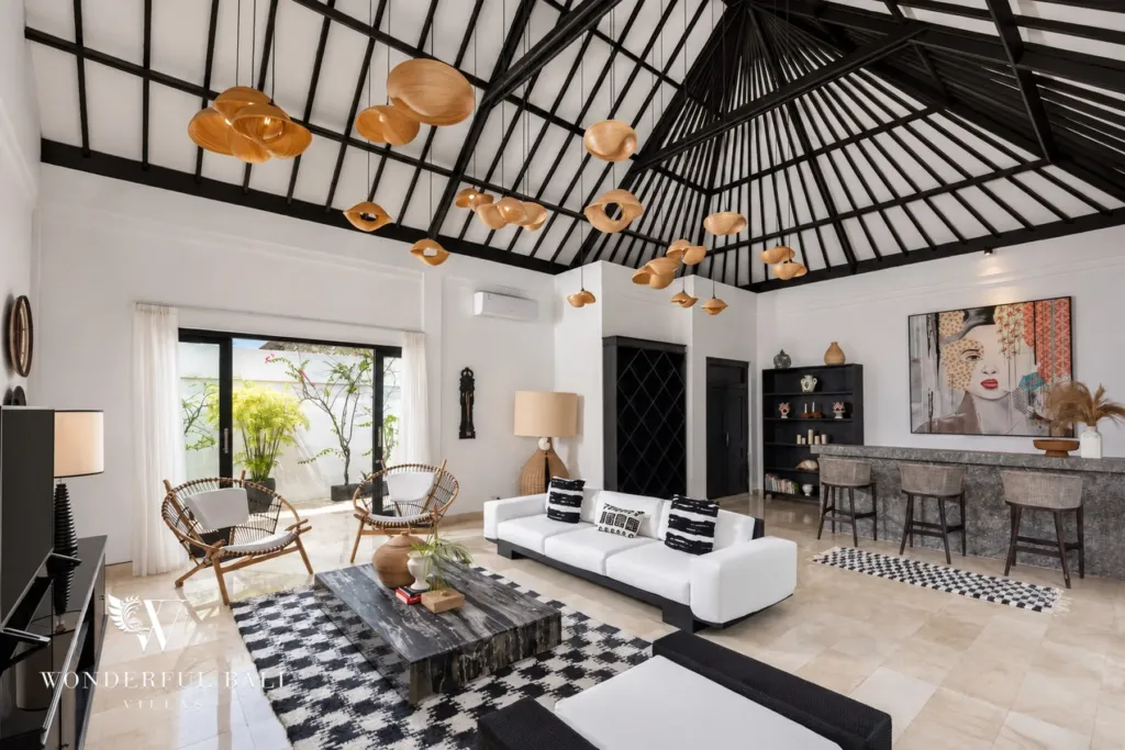 4BR villa for rent in Batu Bolong, Canggu — living room, double-height living pavilion with white sofas and a graphic rug