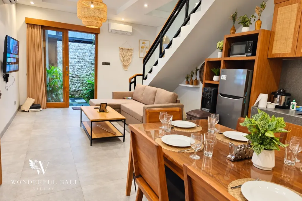 3BR villa for rent in Sanur — living and dining area with glass doors to the garden