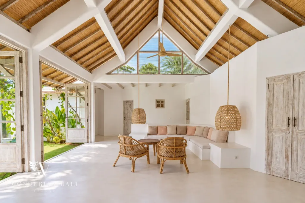 4BR villa for rent in Umalas, Bali — living room, the open-plan living room from the garden side, doors folded back