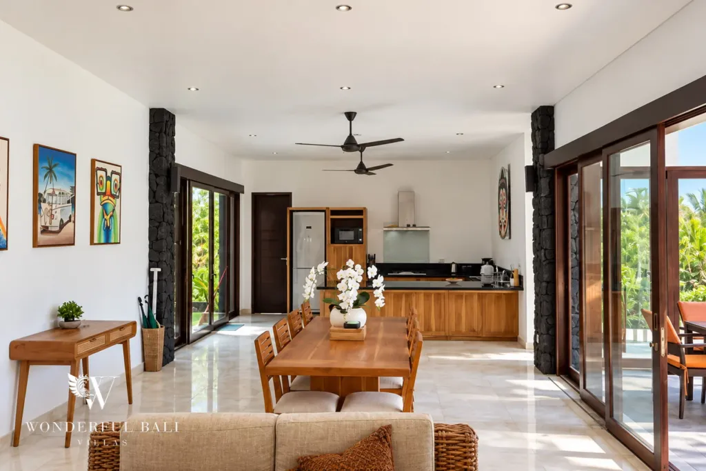 4BR villa for rent in Umalas, Bali — kitchen, open teak kitchen with black granite counters beside the dining area