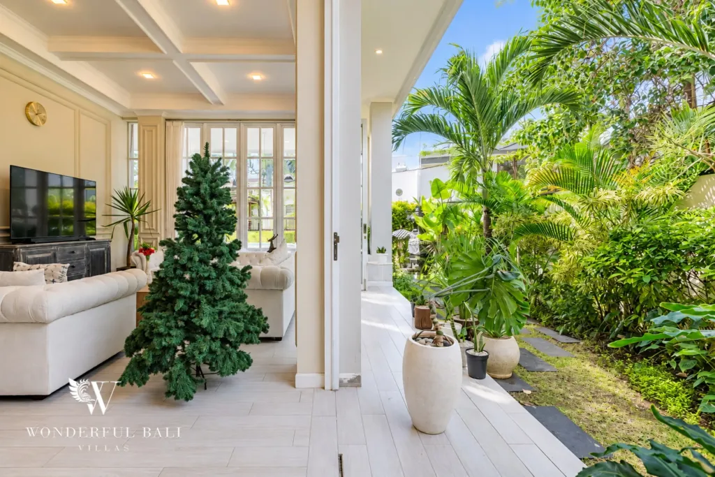 5BR villa for sale in Pererenan — living room with full-height glass doors to the garden