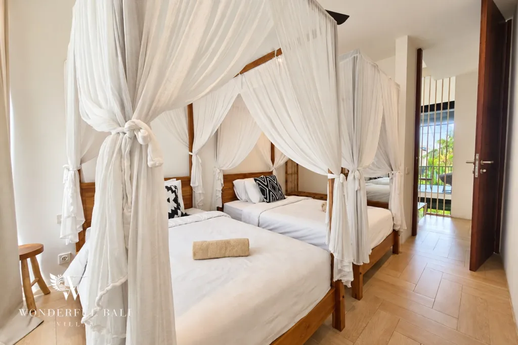 4BR villa for rent in Berawa, Canggu — bedroom, canopy bed draped in white netting