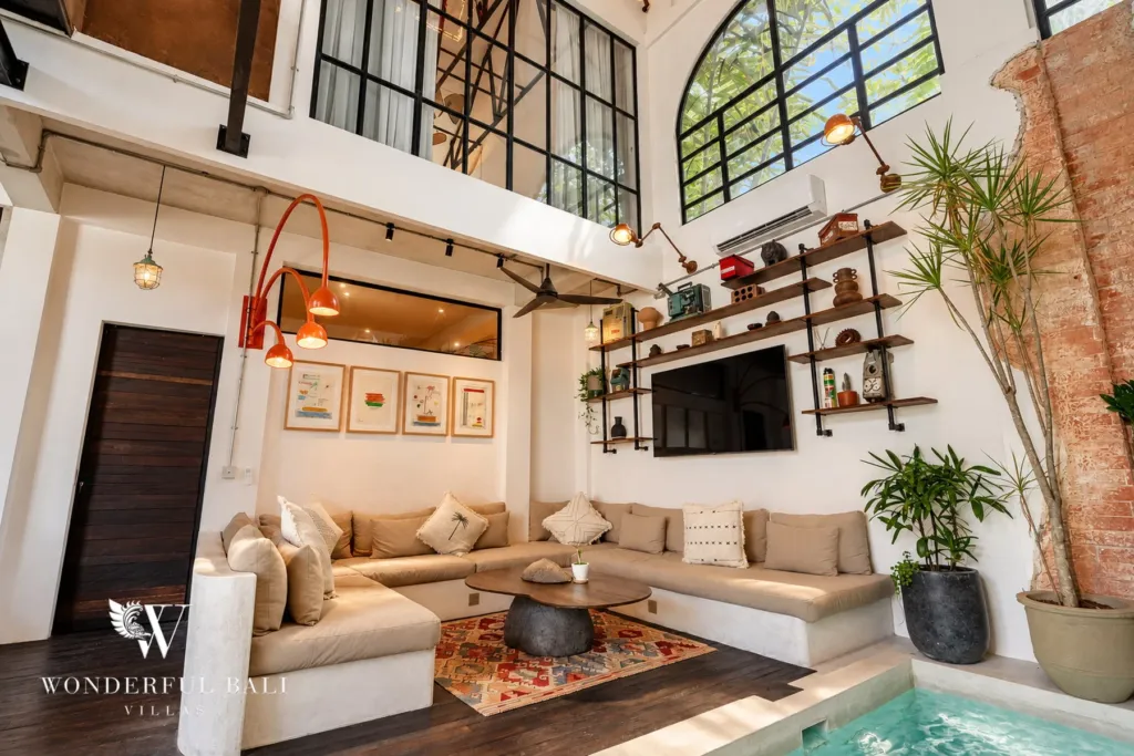 3BR villa for sale in Berawa — living room, sunken lounge with arched steel windows and the indoor pool